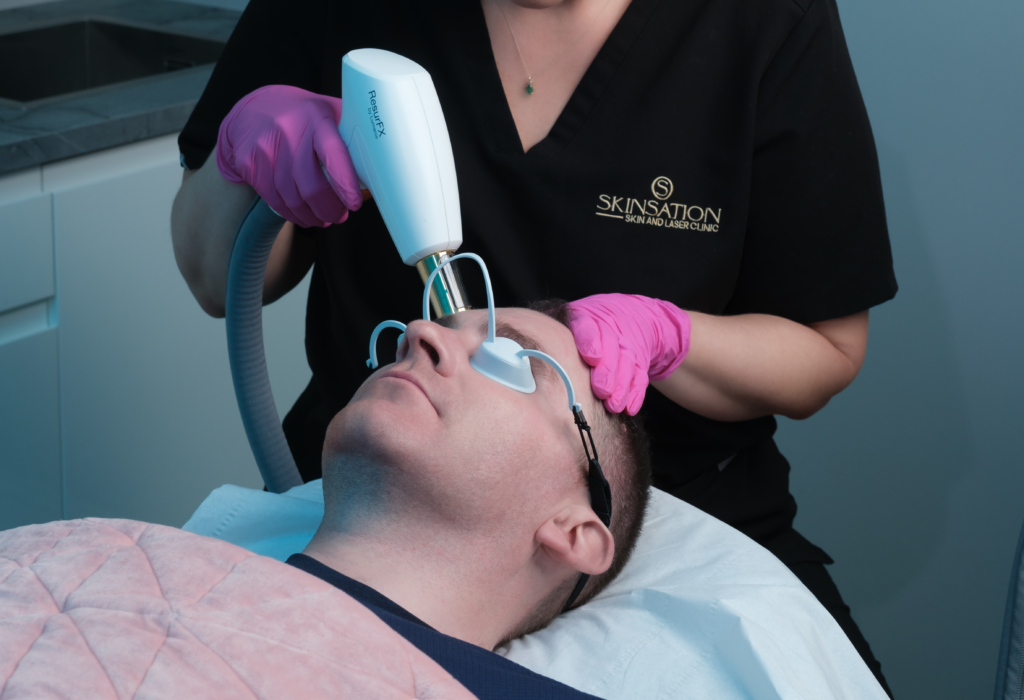 Performing ResurfX Fractional Laser & Photofacial on client Face